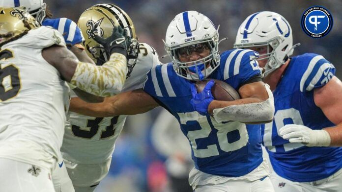 Jonathan Taylor (28) evades New Orleans Saints defenders Sunday, Oct. 29, 2023, at Lucas Oil Stadium in Indianapolis.