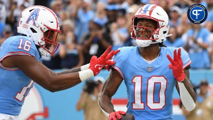 Tennessee Titans wide receiver DeAndre Hopkins (10) celebrates with wide receiver Treylon Burks (16) after his third touchdown of the game during the second half against the Atlanta Falcons at Nissan Stadium.