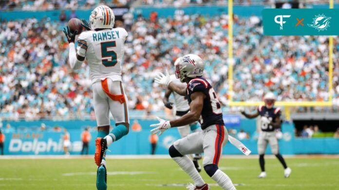 Miami Dolphins CB Jalen Ramsey (5) makes an interception against the New England Patriots.