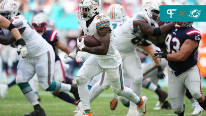 Miami Dolphins running back Raheem Mostert (31) runs with the ball against the New England Patriots during the second half at Hard Rock Stadium.