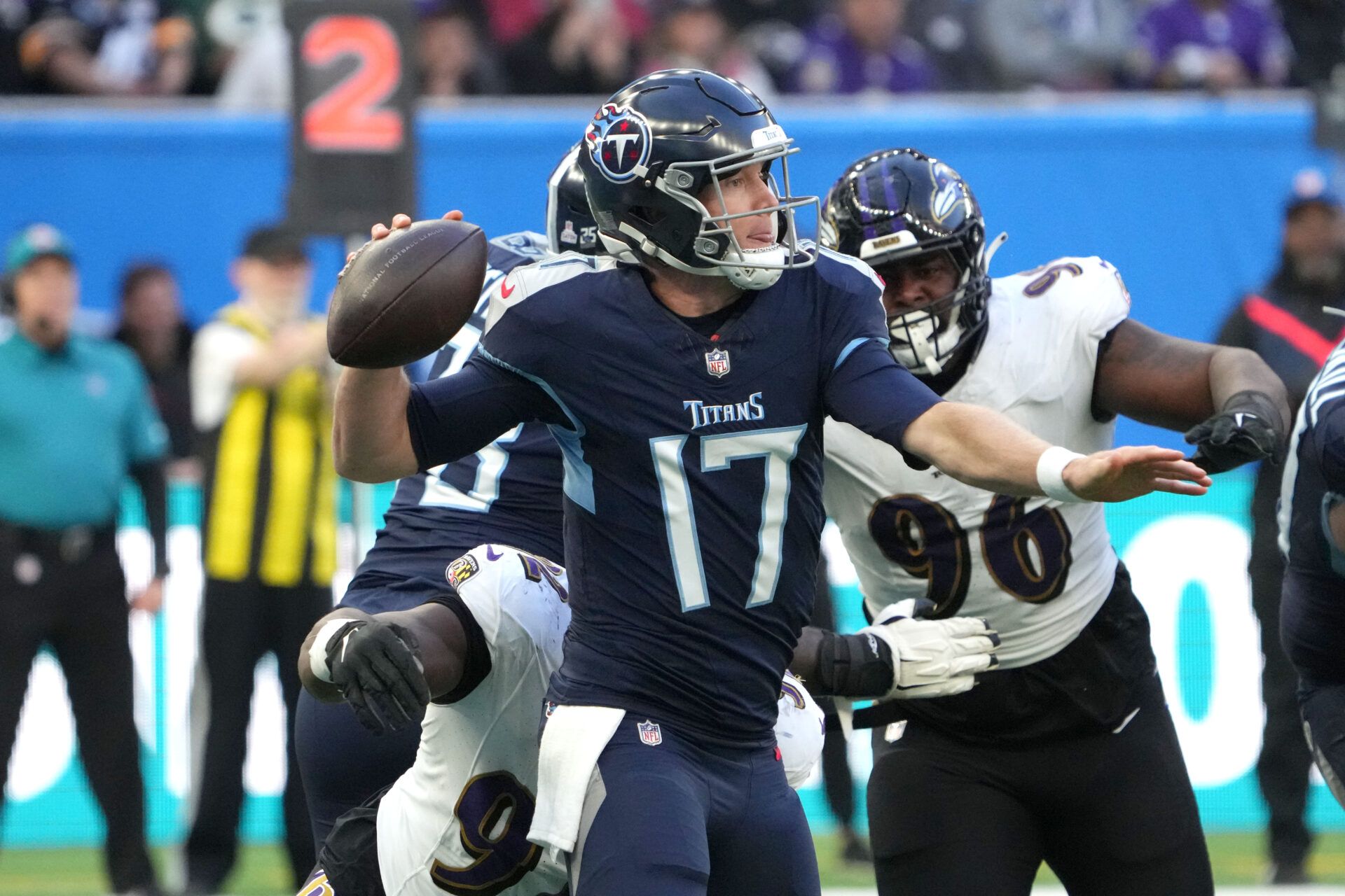 Tennessee Titans quarterback Ryan Tannehill (17) is pressured by Baltimore Ravens defensive tackle Justin Madubuike (92) and defensive tackle Broderick Washington (96) in the second half during an NFL International Series game at Tottenham Hotspur Stadium.