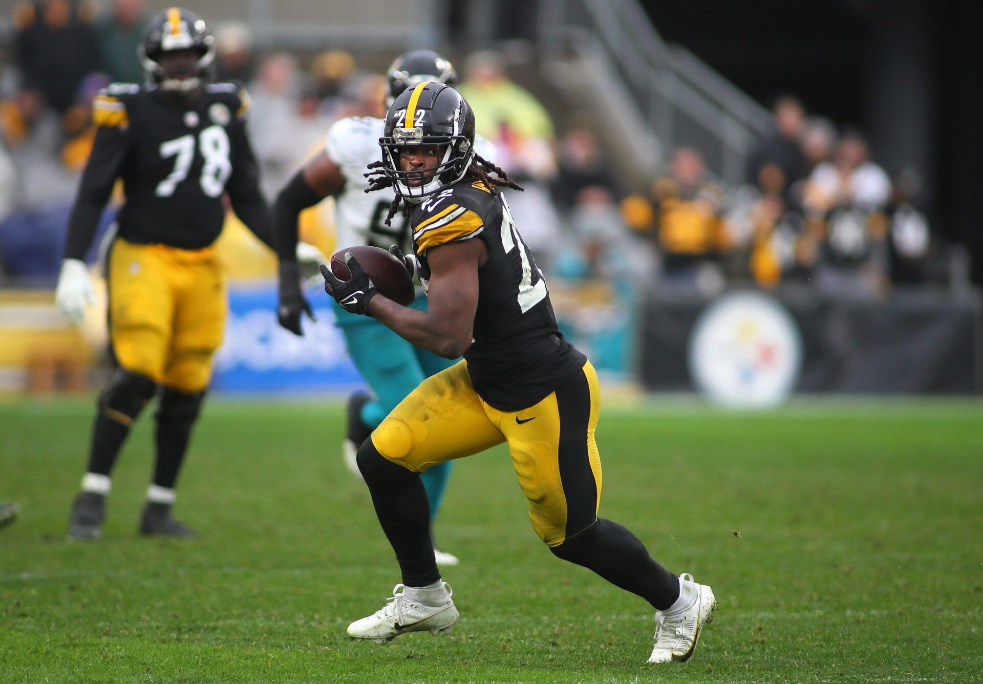 Pittsburgh Steelers Najee Harris (22) looks to gain extra yardage after hauling in a pass during the second half against the Jacksonville Jaguars at Acrisure Stadium