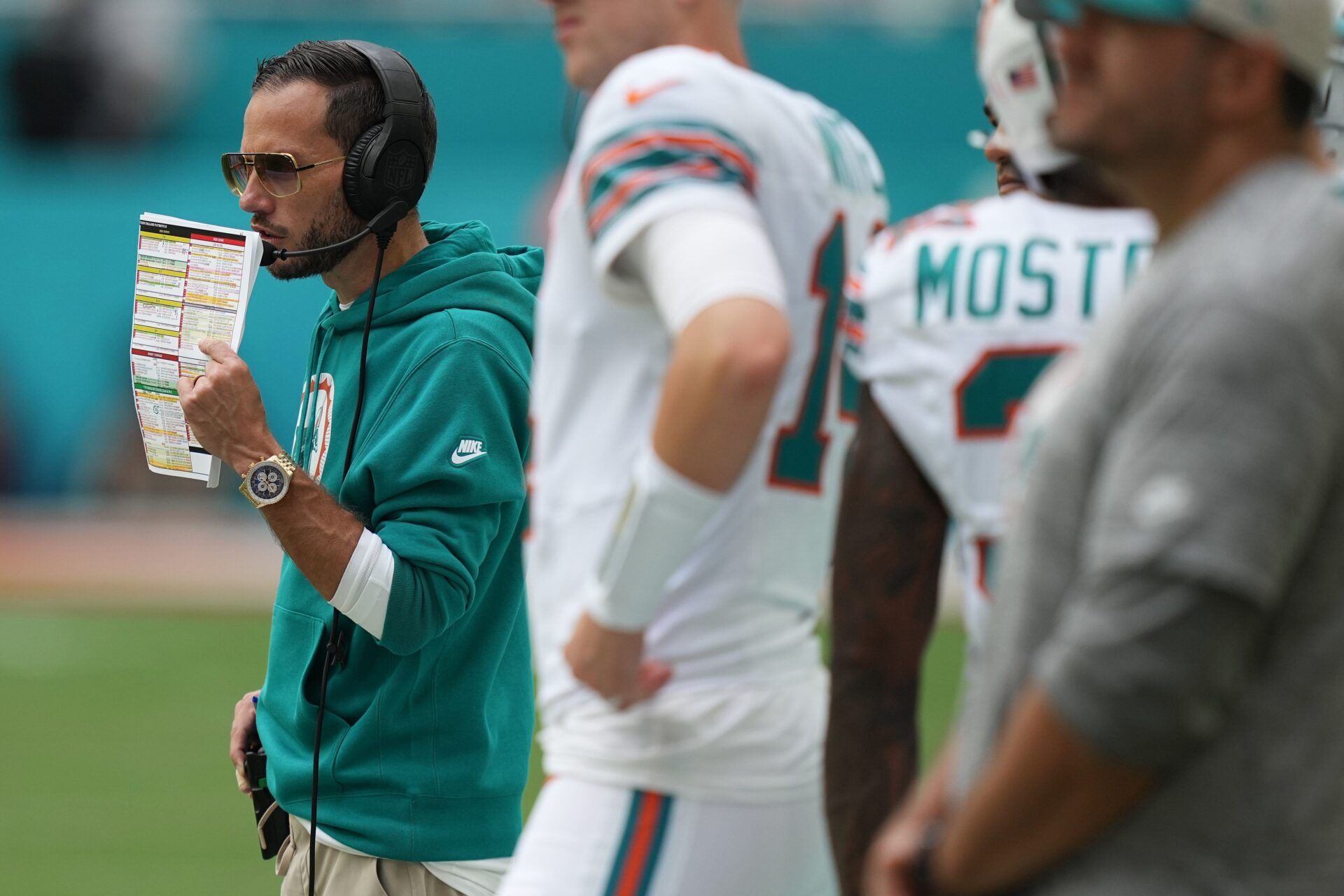 Miami Dolphins head coach Mike McDaniel calls a play during the second half of an NFL game against the New England Patriots at Hard Rock Stadium