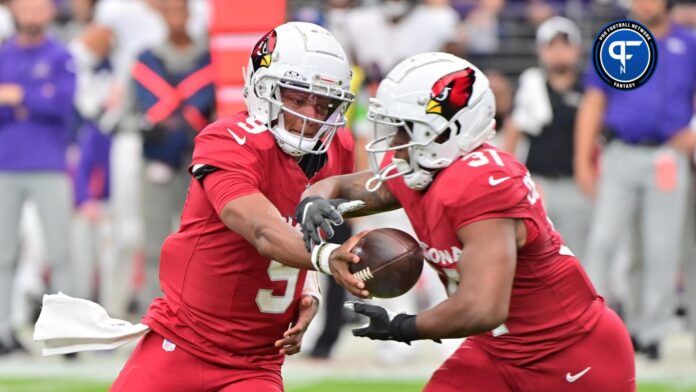 Arizona Cardinals quarterback Joshua Dobbs (9) hands off to running back Emari Demercado (31) in the first half against the Baltimore Ravens at State Farm Stadium.