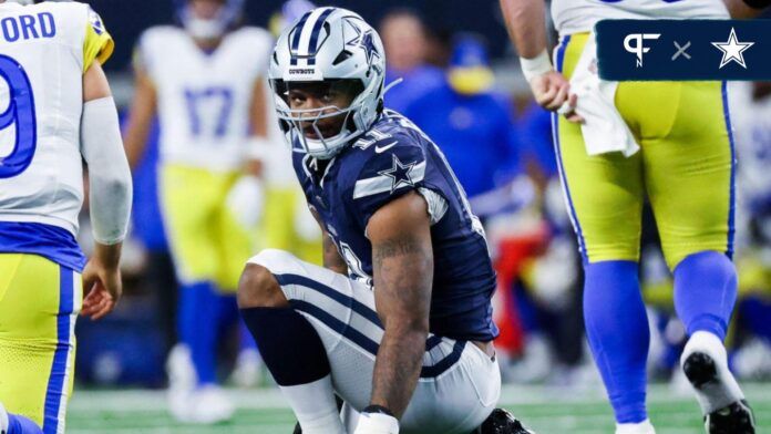 Micah Parsons (11) reacts in front of Los Angeles Rams quarterback Matthew Stafford (9) during the first half at AT&T Stadium.