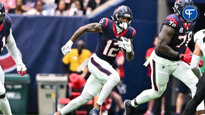 Nico Collins (12) runs the ball during the third quarter against the New Orleans Saints at NRG Stadium.