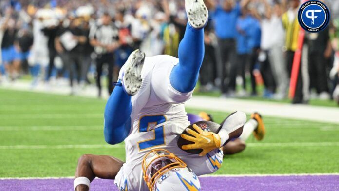 Los Angeles Chargers wide receiver Joshua Palmer (5) catches a touchdown pass from quarterback Justin Herbert (not pictured) off a deflection from Minnesota Vikings cornerback Akayleb Evans (21) during the fourth quarter at U.S. Bank Stadium.