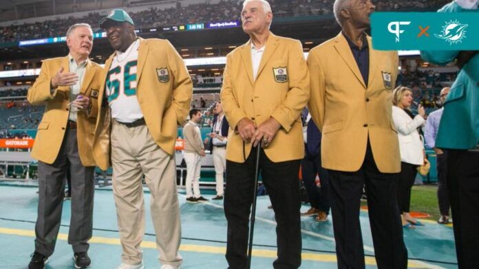 Former members of the 1972 Miami Dolphins Bob Griese, Larry Little, Larry Csonka and Paul Warfield are seen on the sidelines prior to the start of a Miami Dolphins game.