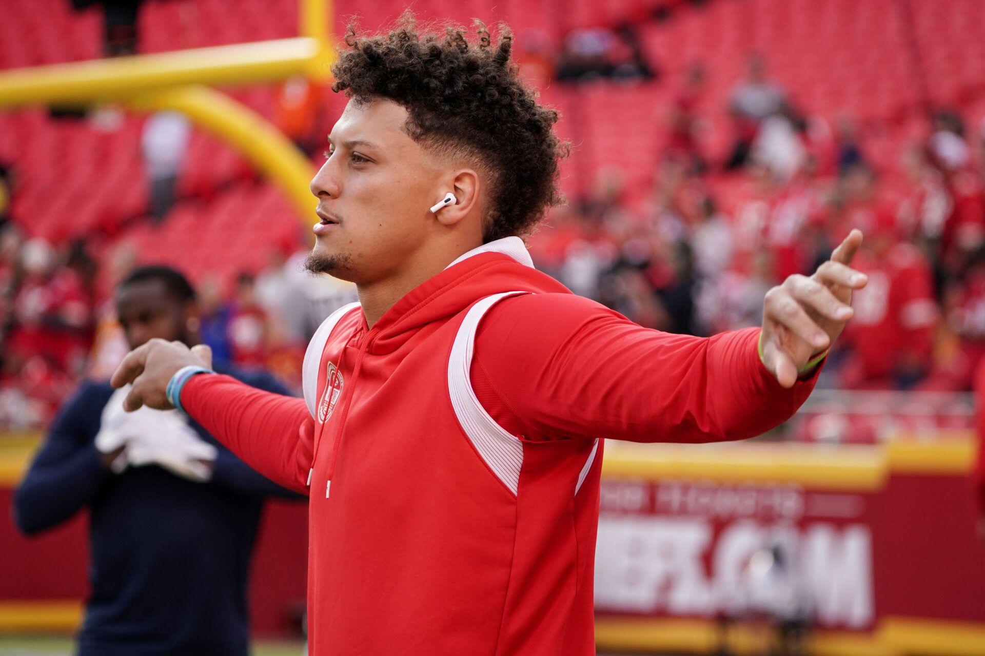 Kansas City Chiefs quarterback Patrick Mahomes (15) warms up on field against the Denver Broncos prior to a game at GEHA Field at Arrowhead Stadium.