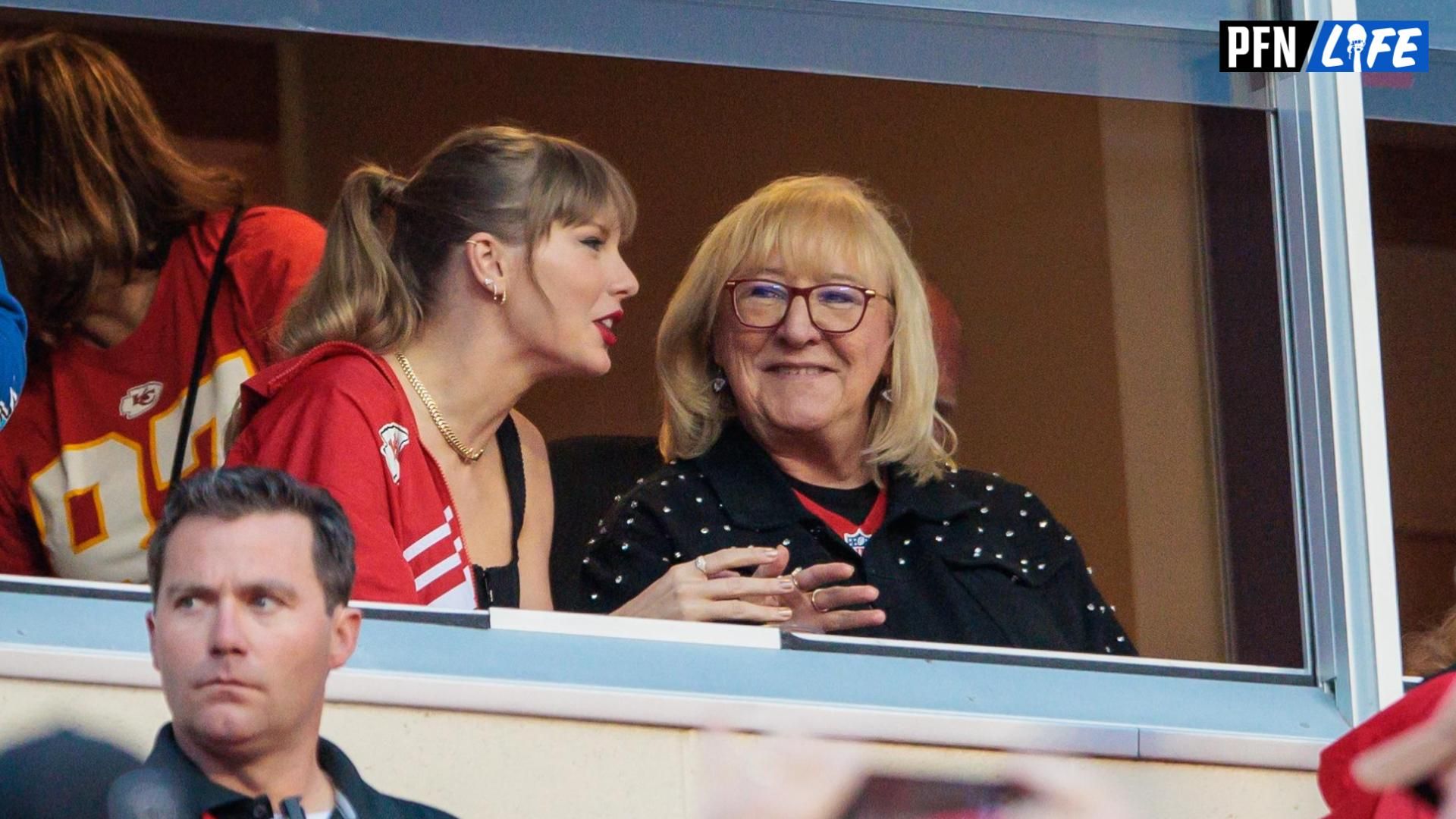 Grammy award winning artist Taylor Swift watches Kansas City Chiefs take the field along with Kansas City Chiefs tight end Travis Kelce (87) mom Donna Kelce prior to the game against the Denver Broncos at GEHA Field at Arrowhead Stadium.