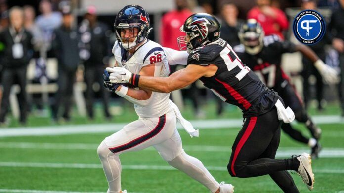 Houston Texans tight end Dalton Schultz (86) runs after a catch against Atlanta Falcons linebacker Kaden Elliss (55) during the first quarter at Mercedes-Benz Stadium.