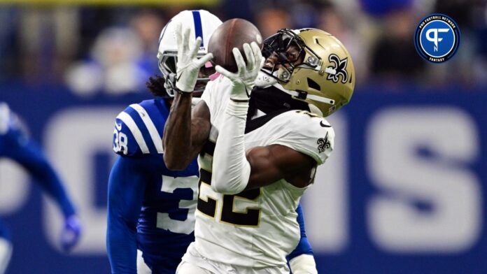 New Orleans Saints wide receiver Rashid Shaheed (22) catches a long pass in front of Indianapolis Colts cornerback Tony Brown (38) during the second half at Lucas Oil Stadium.