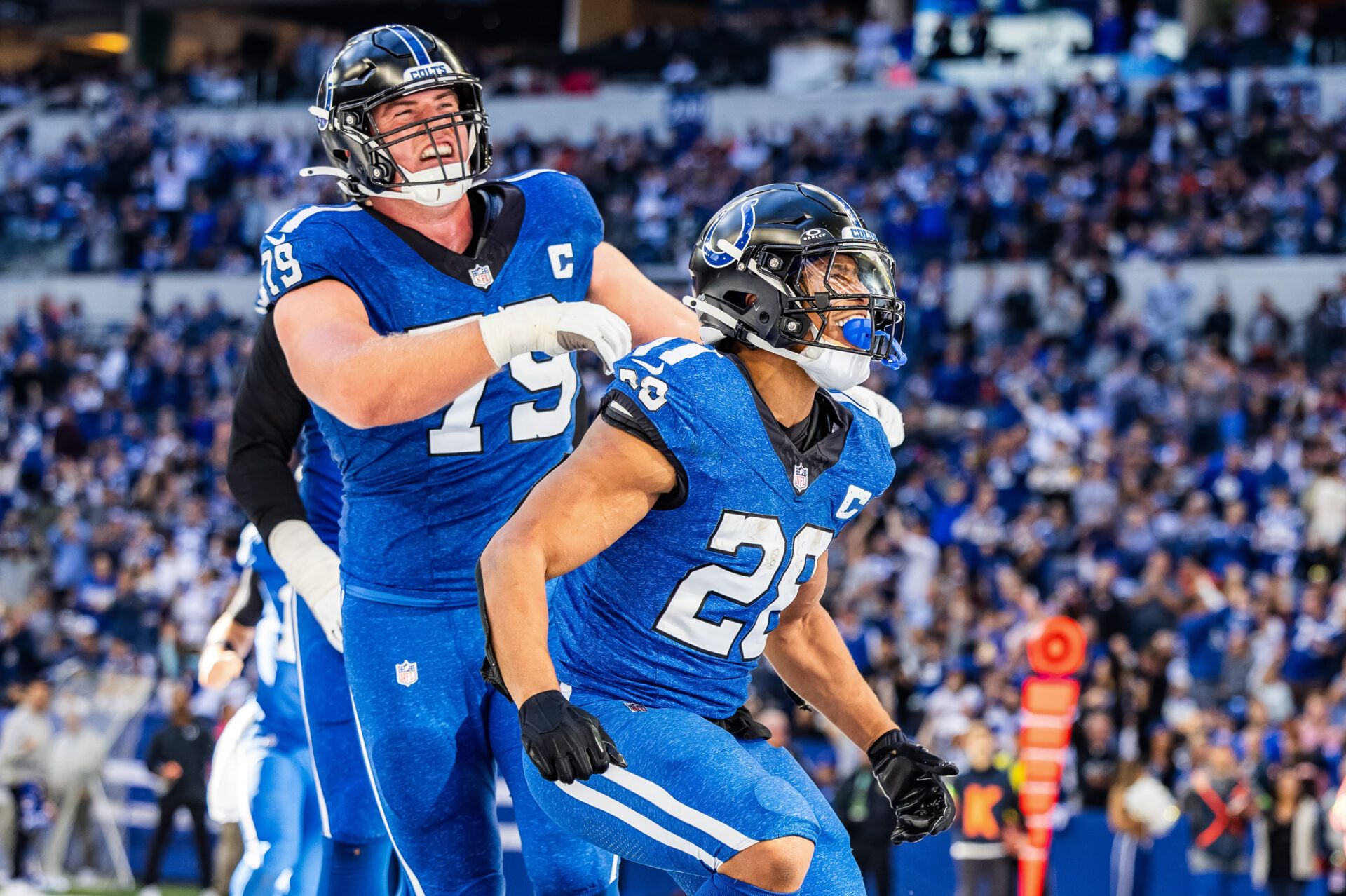 Indianapolis Colts running back Jonathan Taylor (28) celebrates his touchdown with teammates in the second half against the Cleveland Browns at Lucas Oil Stadium.