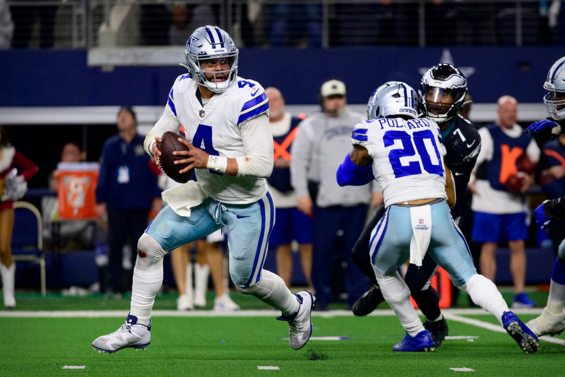Dallas Cowboys quarterback Dak Prescott (4) rolls out against the Philadelphia Eagles during the second half at AT&T Stadium.
