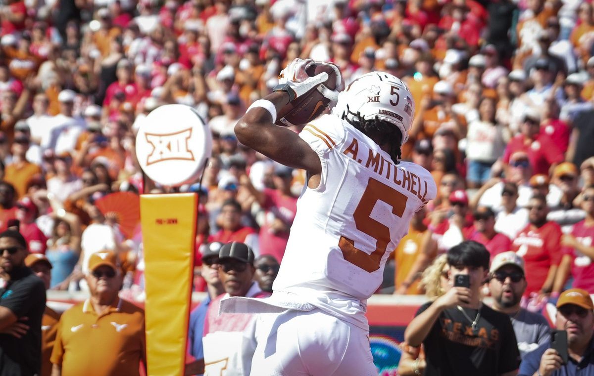 Adonai Mitchell (5) catches the ball in the end zone to score the first touchdown of the game during the first quarter of the Longhorn's game against the Houston Cougars at TDECU Stadium.