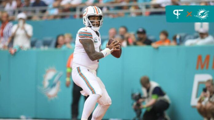 Tua Tagovailoa (1) looks for a passing option against the New England Patriots during the third quarter at Hard Rock Stadium.