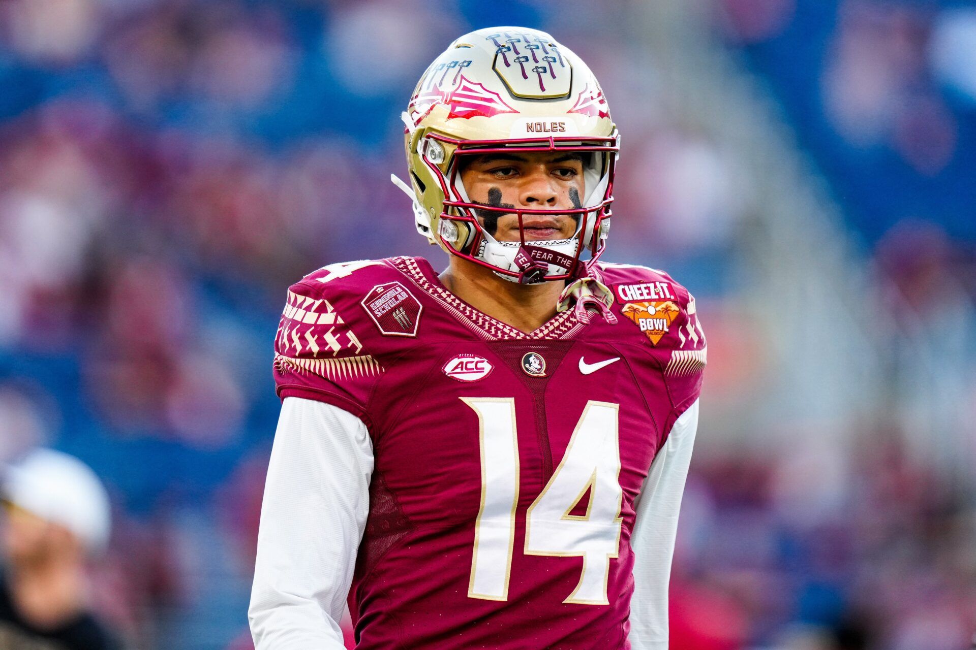 Johnny Wilson (14) warms up prior to a game against the Oklahoma Sooners in the 2022 Cheez-It Bowl at Camping World Stadium.