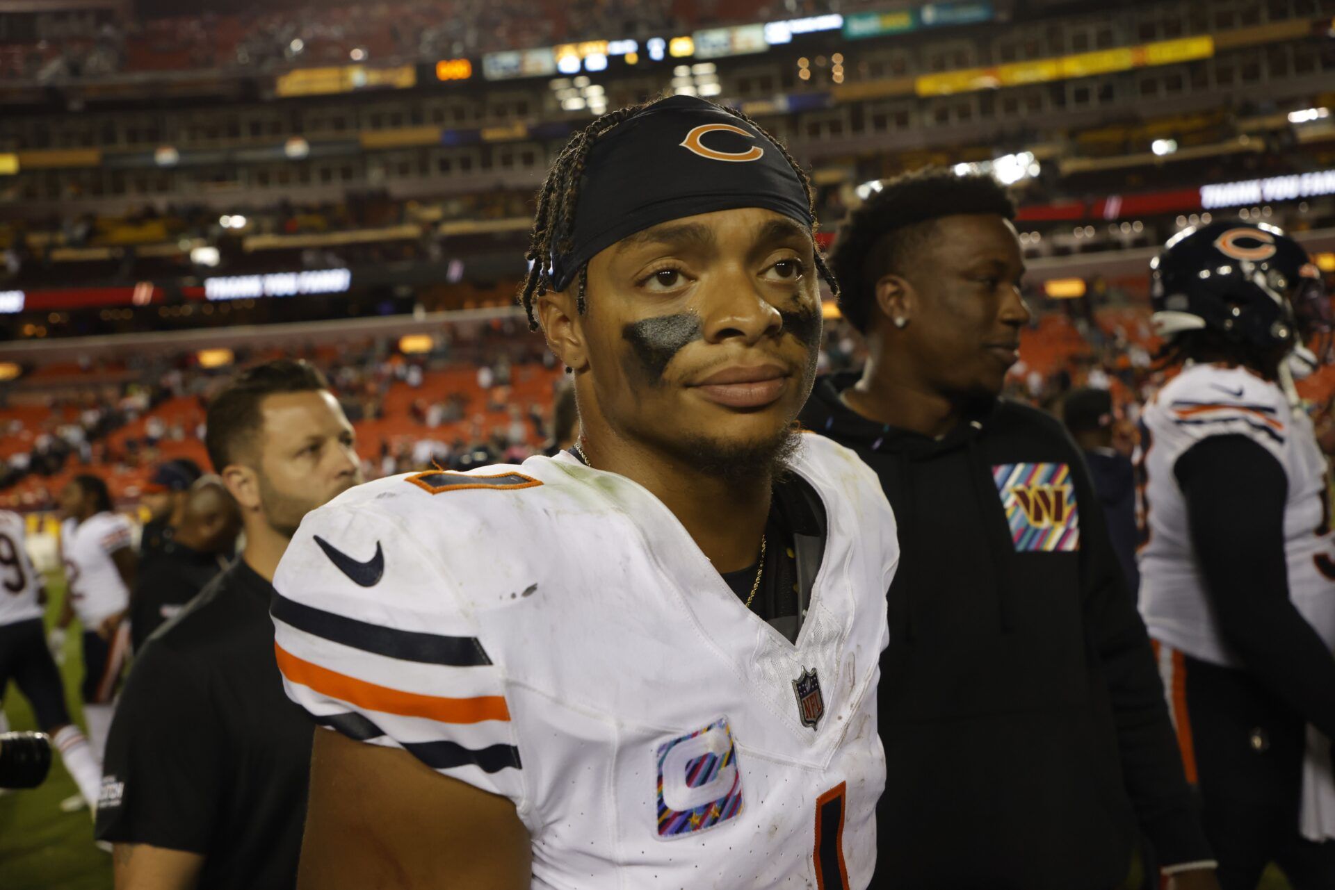 Chicago Bears quarterback Justin Fields (1) walks off the field after the Bears' game against the Washington Commanders at FedExField.