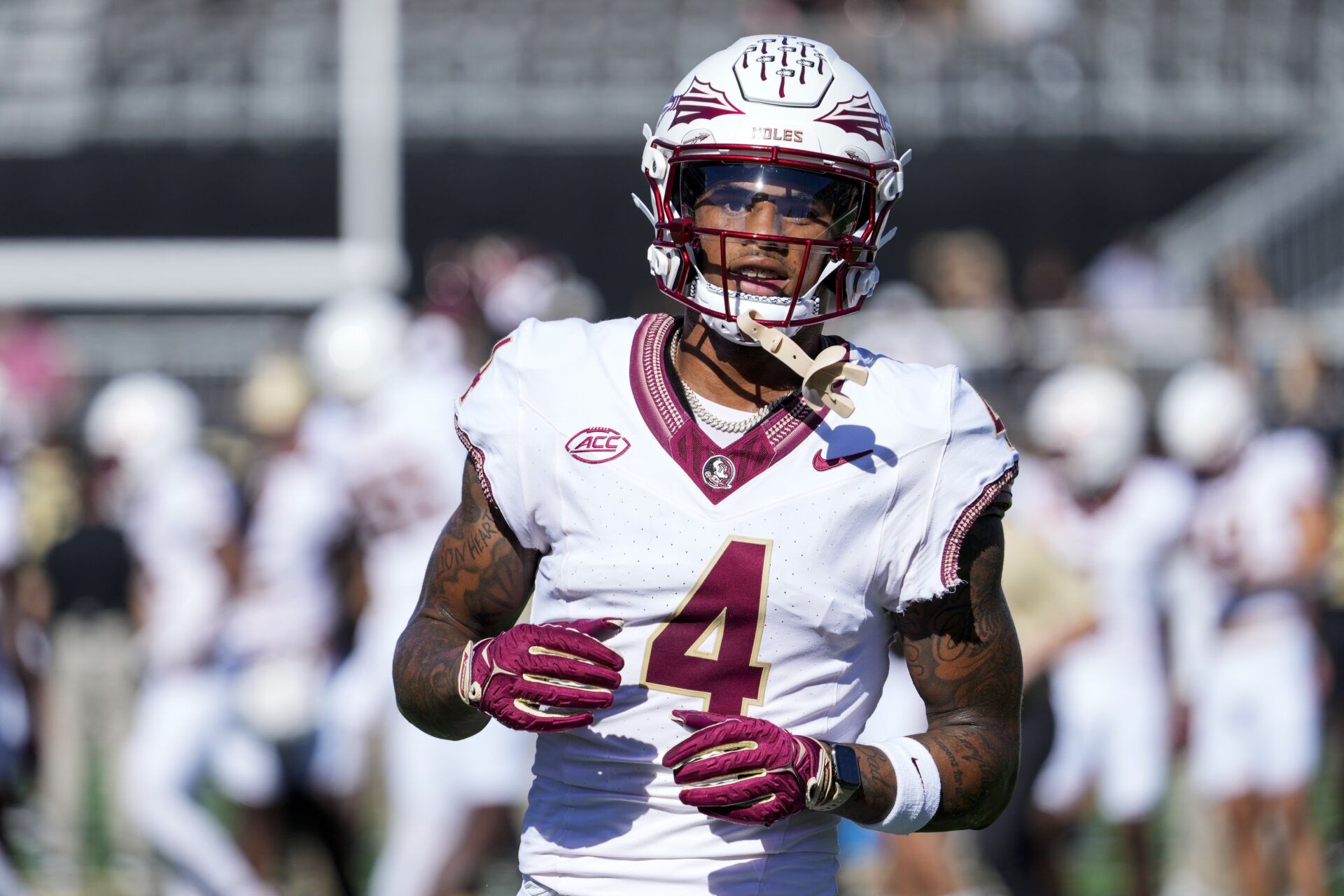 Keon Coleman (4) warms up during the first half against the Wake Forest Demon Deacons at Allegacy Federal Credit Union Stadium.