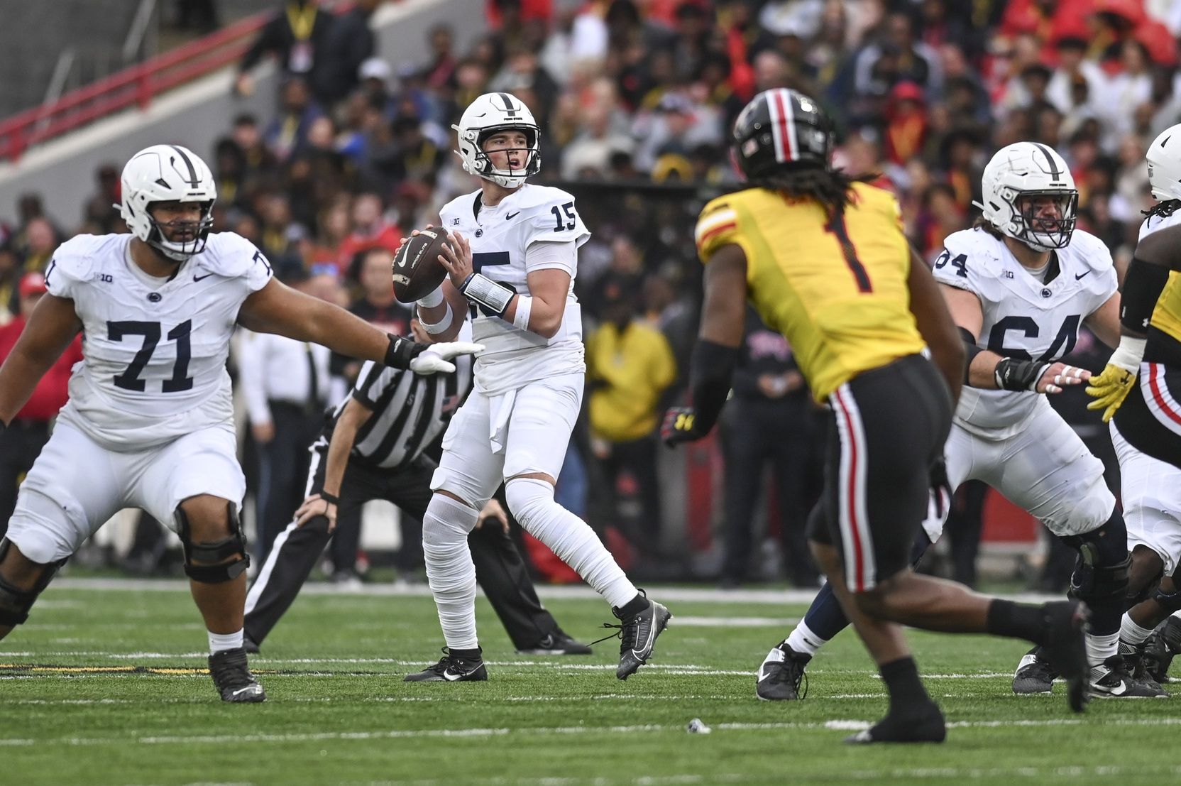 Drew Allar (15) looks to throw during the first half against the Maryland Terrapins at SECU Stadium.