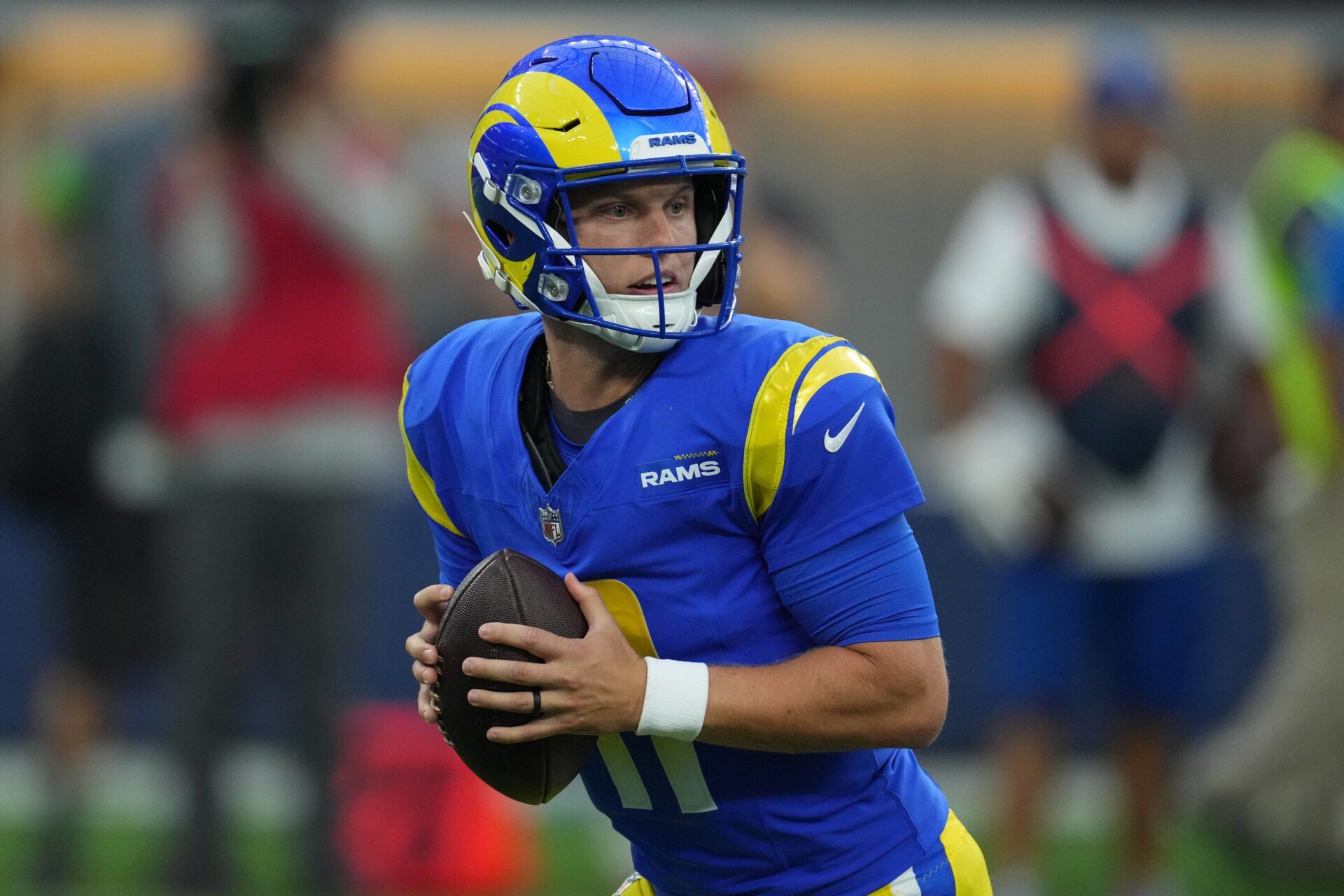 Los Angeles Rams quarterback Brett Rypien (11) throws the ball in the first half against the Los Angeles Chargers at SoFi Stadium.