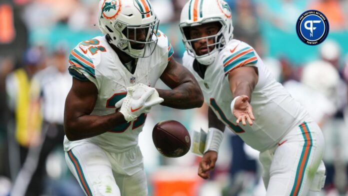 Miami Dolphins running back Raheem Mostert (31) fumbles the handoff from quarterback Tua Tagovailoa (1) during the second half against the New England Patriots at Hard Rock Stadium.