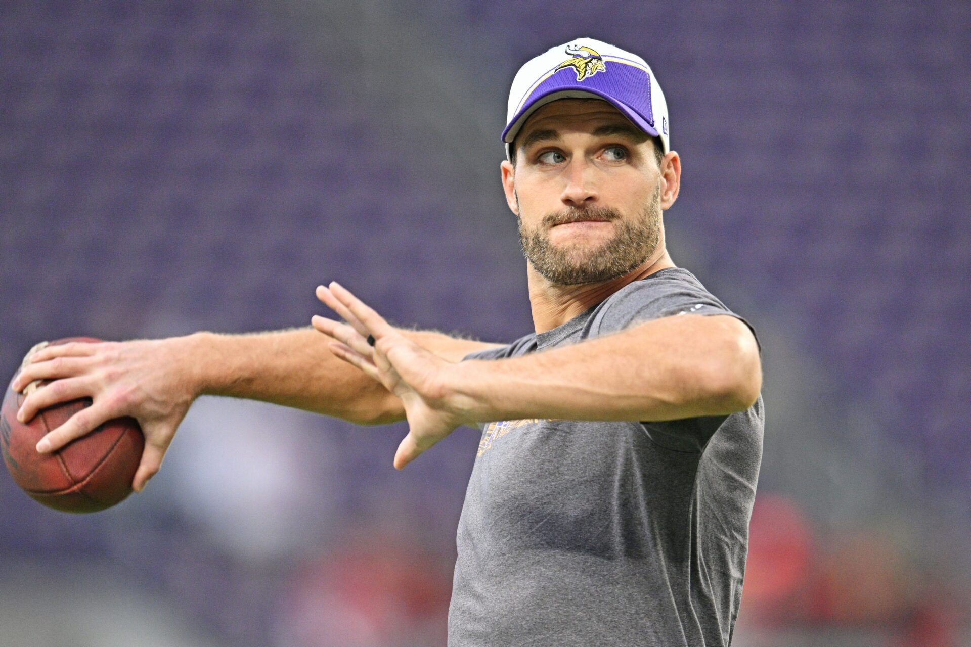 Minnesota Vikings quarterback Kirk Cousins throws passes during warmups.