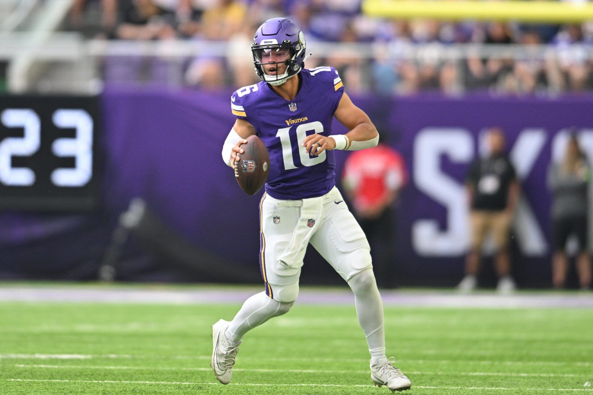 Minnesota Vikings QB Jaren Hall (16) rolls out to pass.