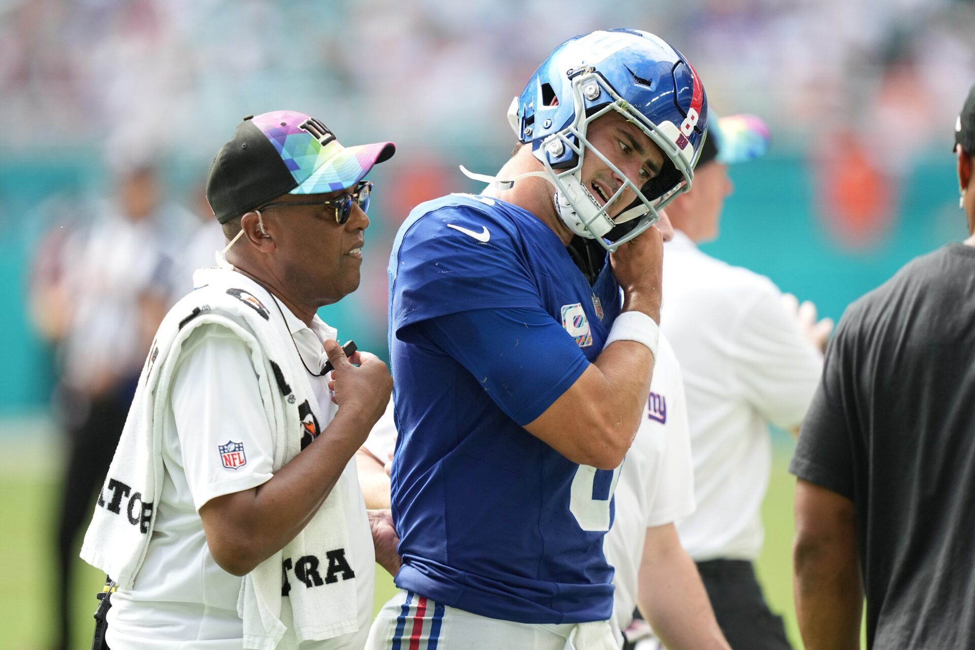 Daniel Jones (8) leaves the game with an injury against the Miami Dolphins during the second half of an NFL game at Hard Rock Stadium.