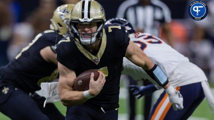 Taysom Hill (7) rushes with the ball against the Chicago Bears during the second half at the Caesars Superdome.