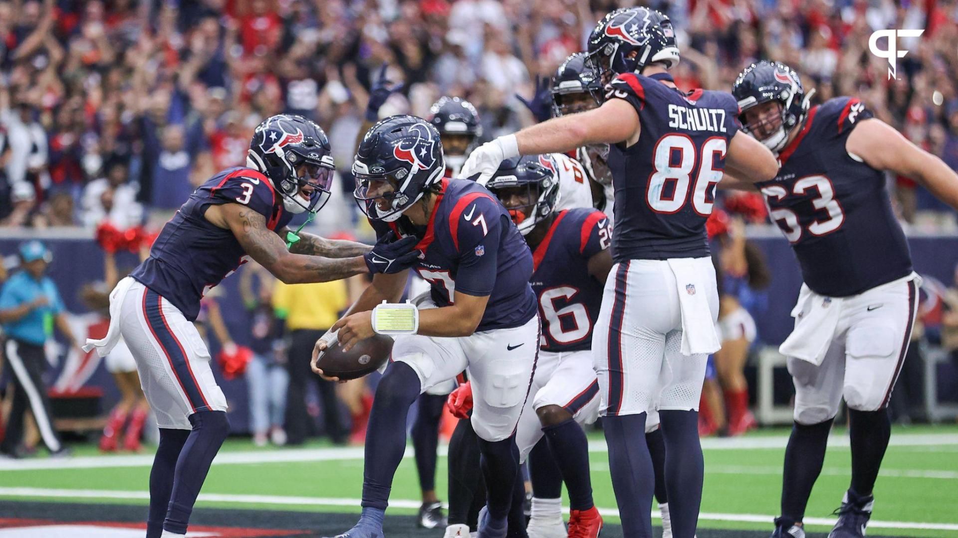 Houston Texans quarterback C.J. Stroud (7) scores on a two-point conversion during the fourth quarter against the Tampa Bay Buccaneers at NRG Stadium.