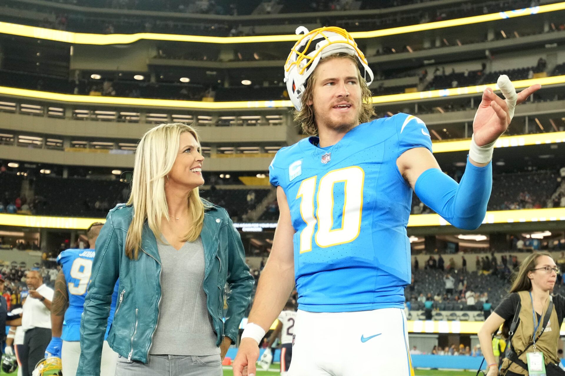 NBC Sports Sunday Night Football sideline reporter Melissa Stark (left) interviews Los Angeles Chargers quarterback Justin Herbert (10) after the game against the Chicago Bears at SoFi Stadium.