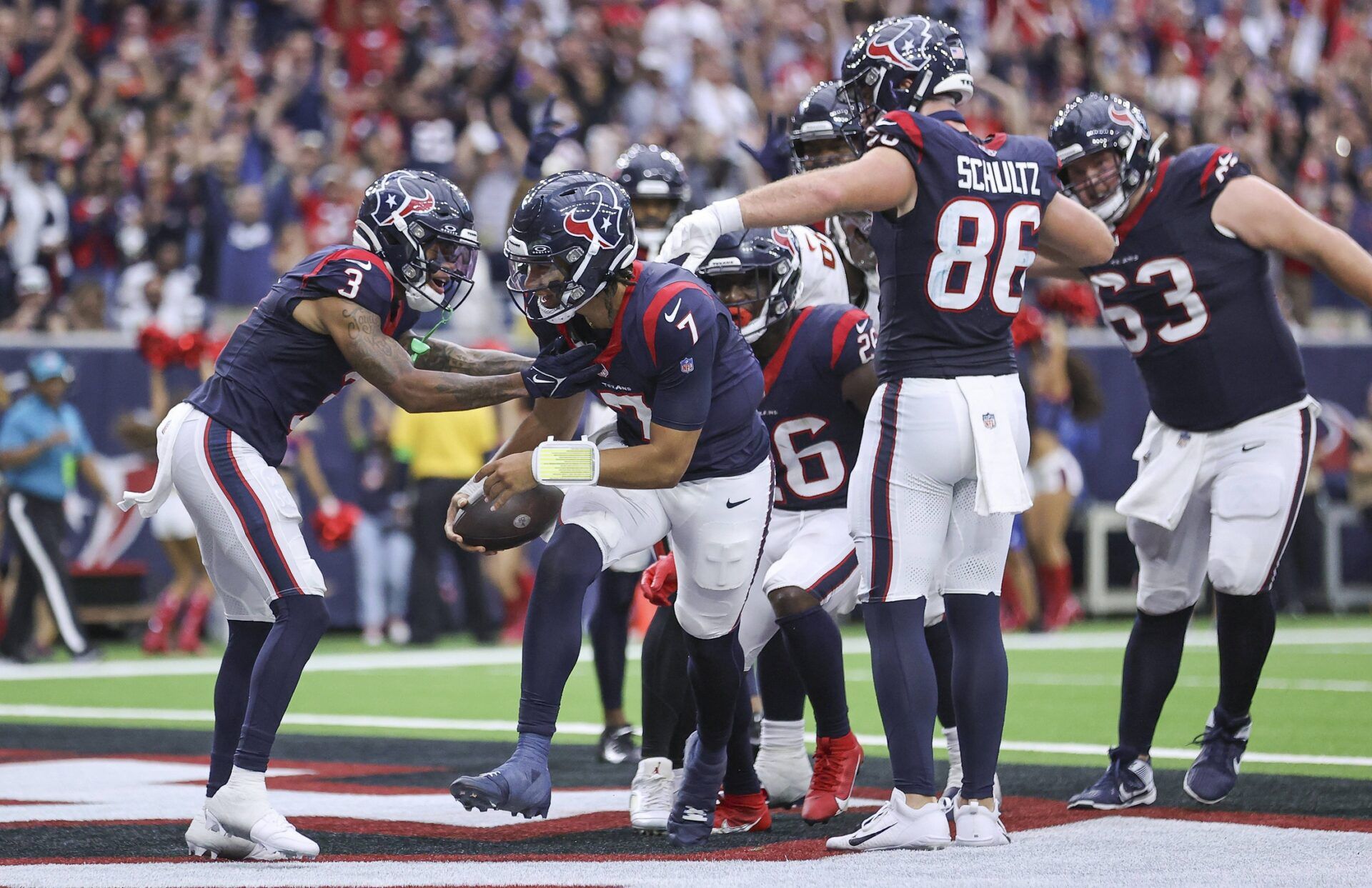 Houston Texans quarterback C.J. Stroud (7) scores on a two-point conversion during the fourth quarter against the Tampa Bay Buccaneers at NRG Stadium.