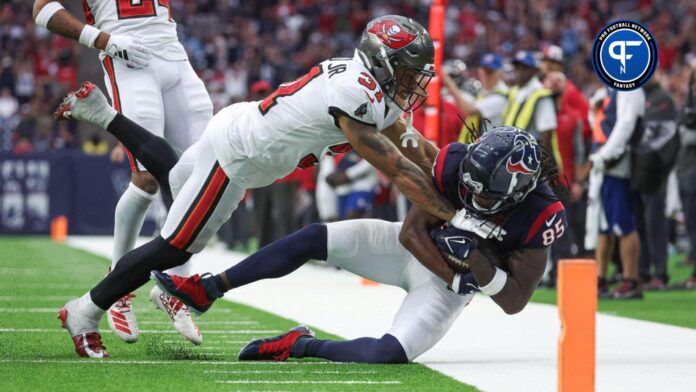 Tampa Bay Buccaneers safety Antoine Winfield Jr. (31) attempts to tackle Houston Texans wide receiver Noah Brown (85) after a reception during the fourth quarter at NRG Stadium.