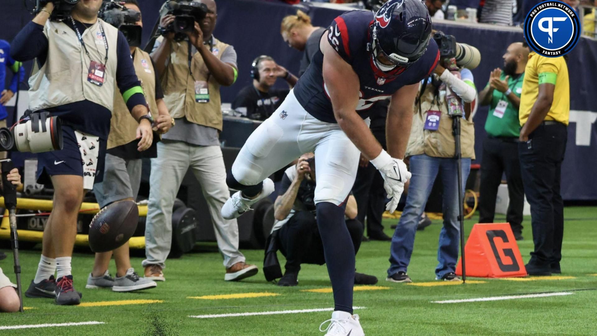 Houston Texans tight end Dalton Schultz (86) spikes the ball after scoring a touchdown against the Tampa Bay Buccaneers.