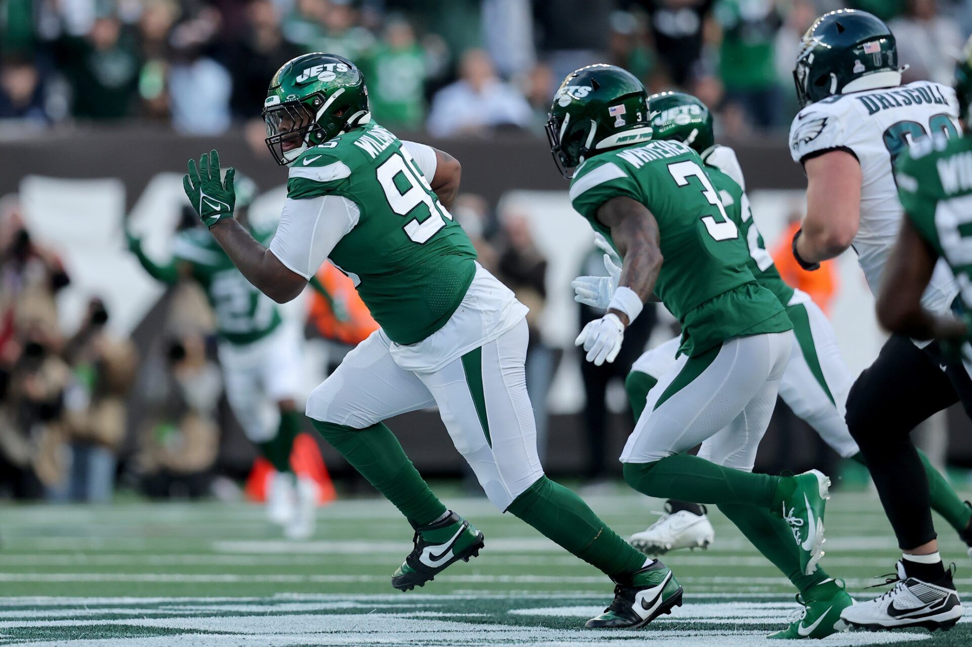 New York Jets DT Quinnen Williams (95) runs with the ball after an interception against the Philadelphia Eagles.