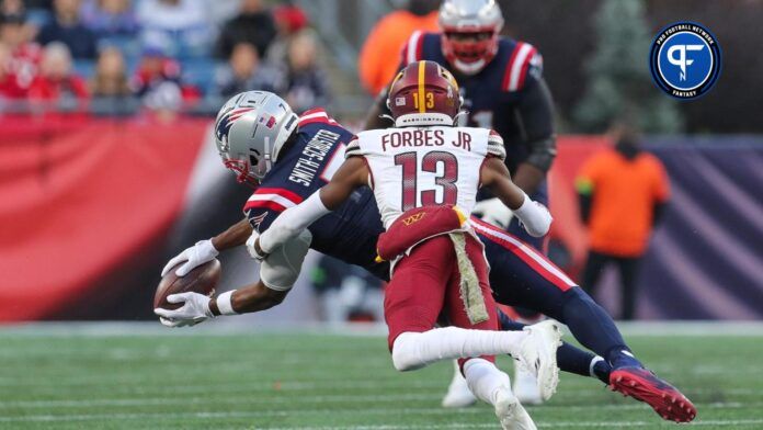 New England Patriots WR JuJu Smith-Schuster (7) makes a catch against the Washington Commanders.