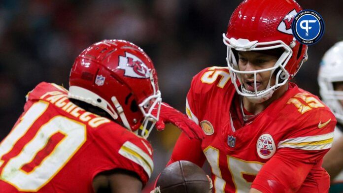 Kansas City Chiefs quarterback Patrick Mahomes (15) hands off to running back Isiah Pacheco (10) in the fourth quarter during an NFL International Series game at Deutsche Bank Park.