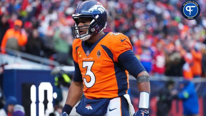 Russell Wilson (3) celebrates a touchdown pass in the fourth quarter against the Kansas City Chiefs at Empower Field at Mile High.