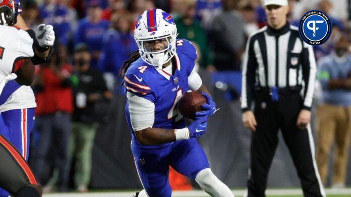 Buffalo Bills running back James Cook (4) finds a big hole at the line of scrimmage against Tampa Bay.