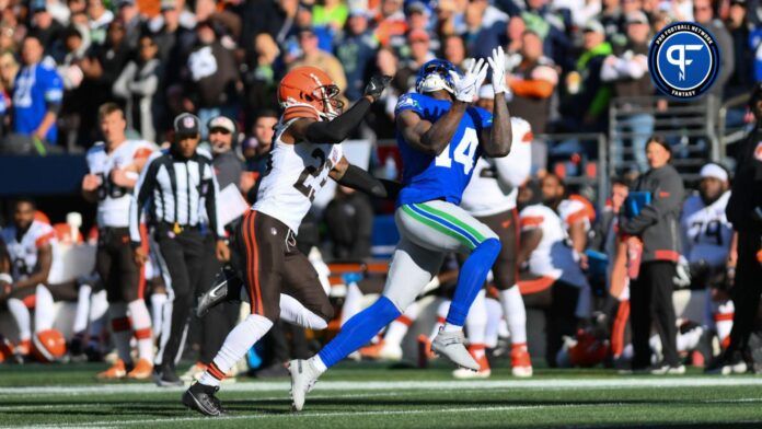 DK Metcalf (14) catches a pass over Cleveland Browns cornerback Martin Emerson Jr. (23) during the first half at Lumen Field.