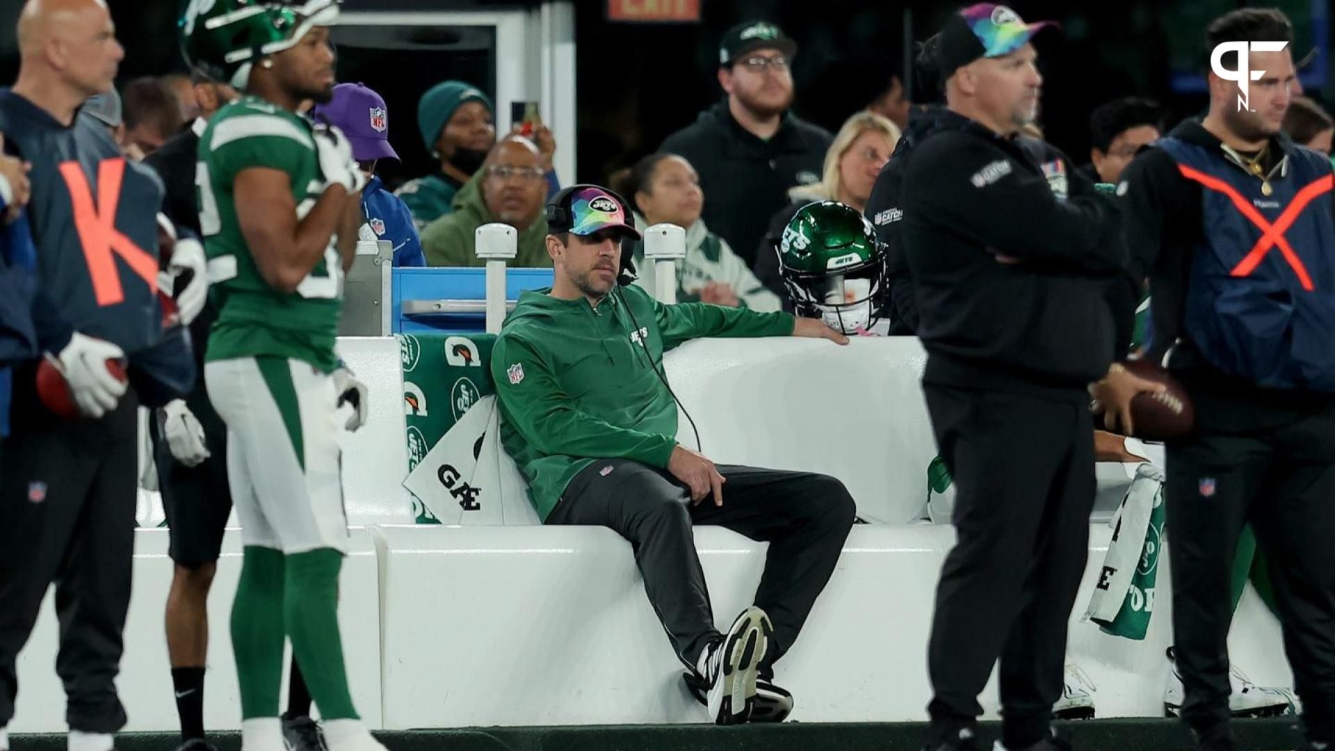 New York Jets injured quarterback Aaron Rodgers sits on the bench during the fourth quarter against the Philadelphia Eagles.