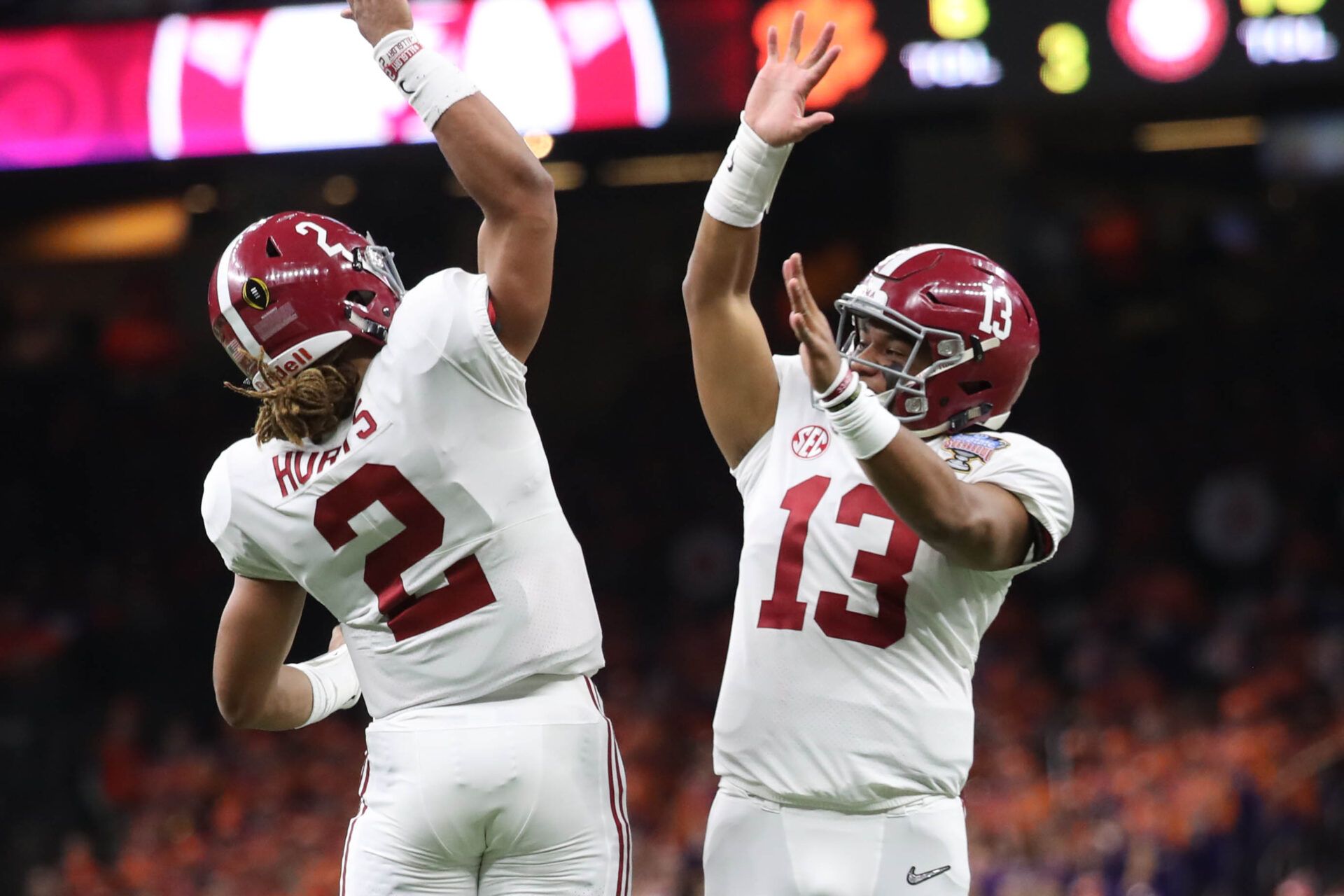 Alabama Crimson Tide quarterback Jalen Hurts (2) celebrates with quarterback Tua Tagovailoa (13) during the third quarter Clemson Tigers in the 2018 Sugar Bowl college football playoff semifinal game at Mercedes-Benz Superdome.