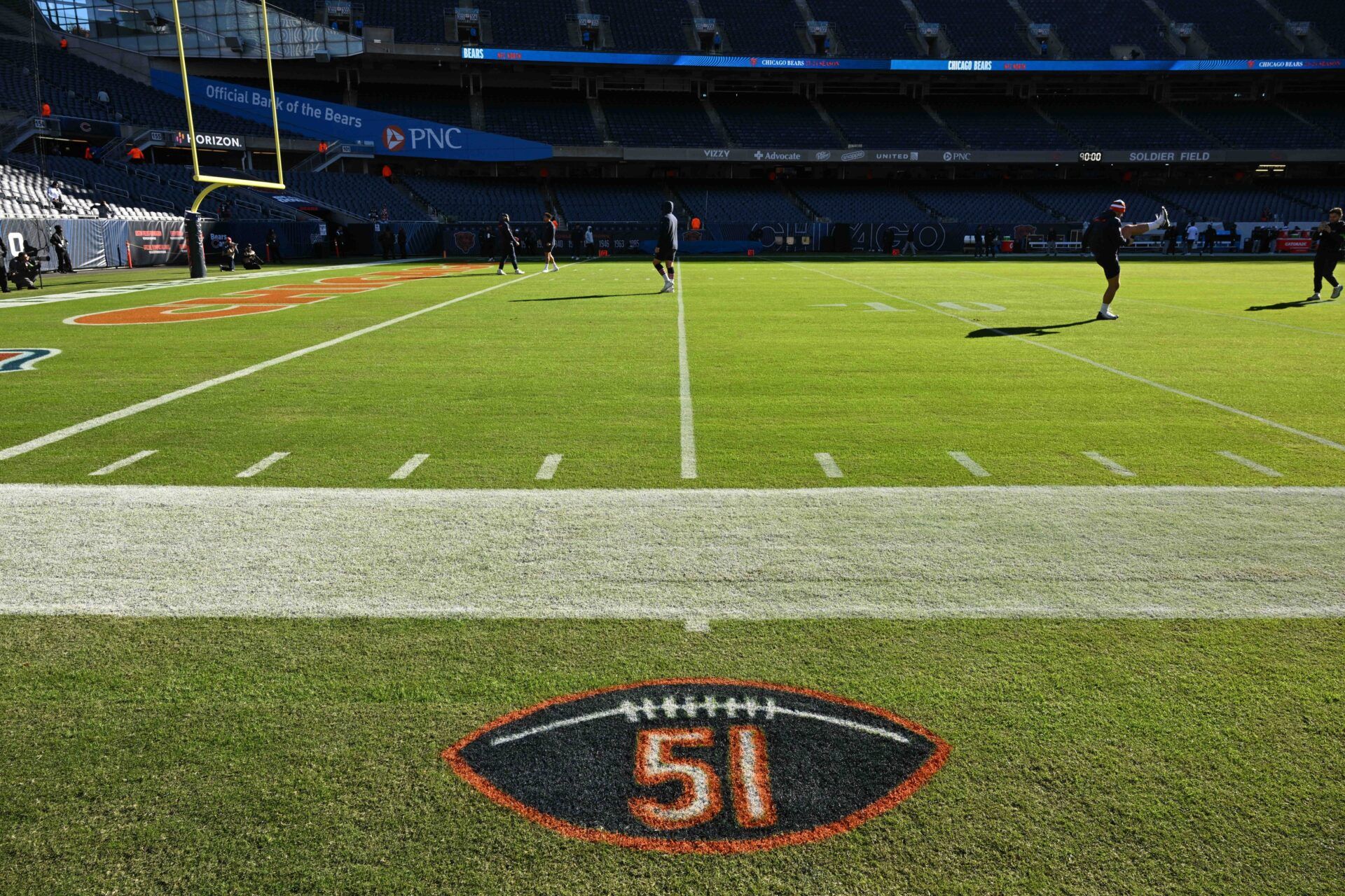 A general view of a logo painted on the sideline to honor the memory of former Chicago Bear and Hall of Famer Dick Butkus before a game between the Las Vegas Raiders and the Chicago Bears at Soldier Field.