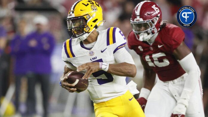 LSU Tigers QB Jayden Daniels (5) runs with the ball against the Alabama Crimson Tide.