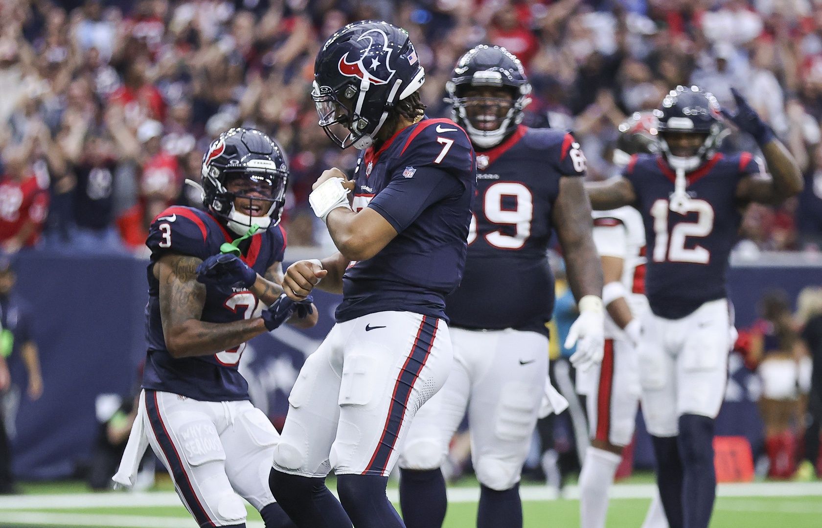 Houston Texans quarterback C.J. Stroud (7) celebrates after scoring a two-point conversion during the fourth quarter against the Tampa Bay Buccaneers at NRG Stadium.