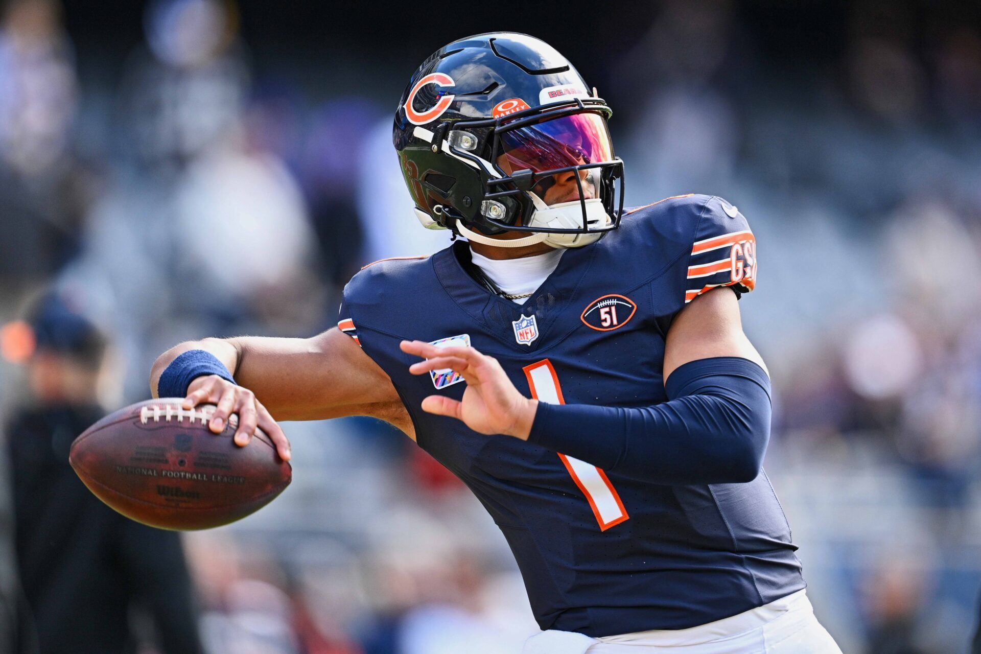 Chicago Bears QB Justin Fields (1) throws a pass during warmups.