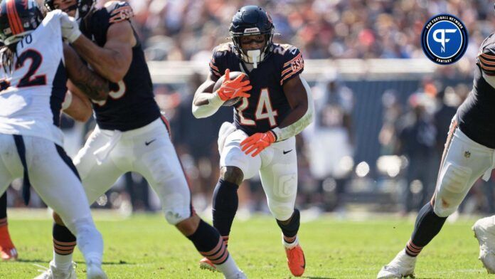 Chicago Bears running back Khalil Herbert carries the football.