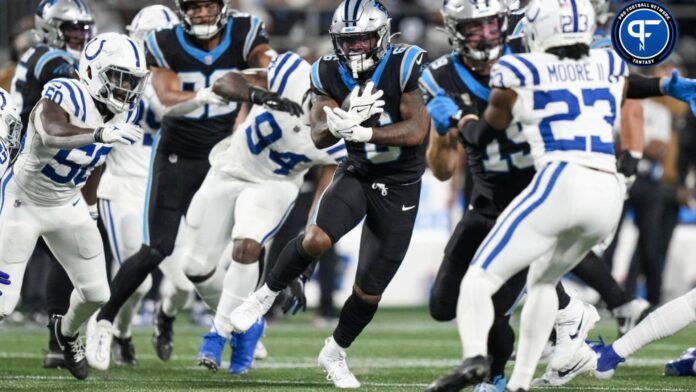 Carolina Panthers running back Miles Sanders (6) runs behind blockers against the Indianapolis Colts.