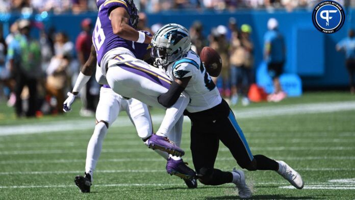 Minnesota Vikings wide receiver Justin Jefferson (18) is tackled by Carolina Panthers cornerback D'Shawn Jamison (29).